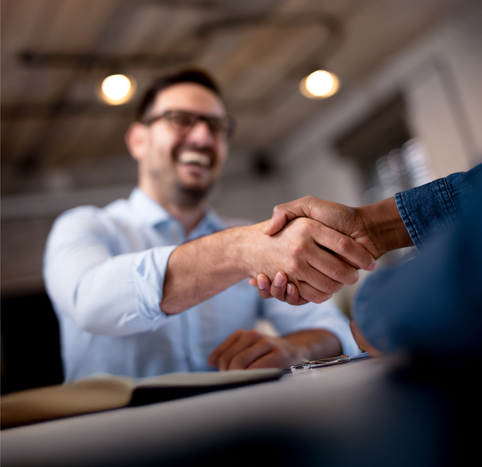 Man, happily taking a handshake